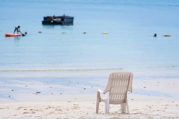 Empty Chair on the beach  at Vongdeuan beach sunset in the Koh Samet island, Rayong, Thailand.
