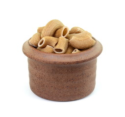 Rustic rigatoni pasta isolated on white background. Maccheroni integrals pasta. Wholemeal Pasta. Close-up on a Integral Penne.