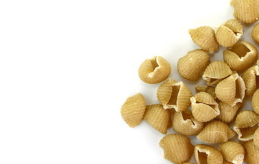 Wholemeal pasta on a white background 