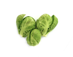 a pile of Brussels sprouts on a white background.