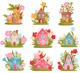 Set of fabulous houses among the flowers and grass. Vector illustration on white background. © Happypictures