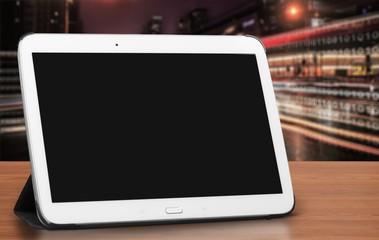 Modern digital tablet on wooden background