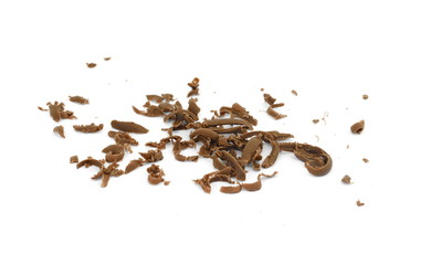 Grated chocolate. Heap of ground chocolate isolated on white background with clipping path, closeup.