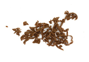 Grated chocolate. Heap of ground chocolate isolated on white background with clipping path, closeup.