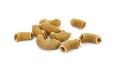 Rustic rigatoni pasta isolated on white background. Maccheroni integrals pasta. Wholemeal Pasta. Close-up on a Integral Penne.