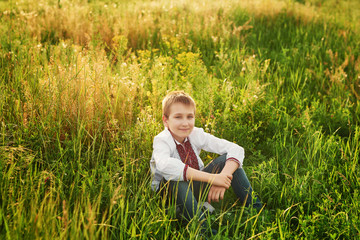 Ukraine's Independence Day. Child boy in an embroidered shirt in field. Ukraine in field. Child kozak. Patriot child.