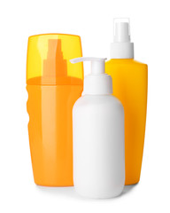 Assortment of sun protection creams on white background