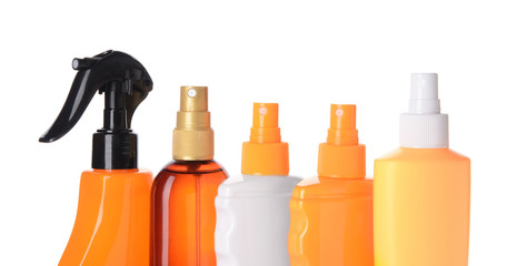 Sun protection cosmetics on white background