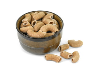 Rustic rigatoni pasta isolated on white background. Maccheroni integrals pasta. Wholemeal Pasta. Close-up on a Integral Penne.