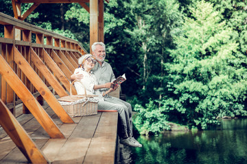 Appealing spouses having a good time while reading together