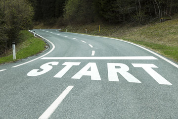 Fototapeta premium Start message on curvy countryside asphalt road