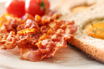 Plate with tasty fried bacon, closeup