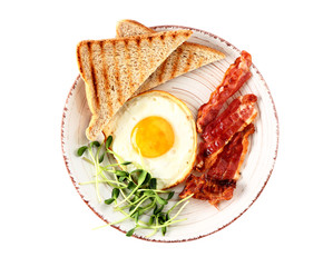 Plate with tasty fried egg, bacon and toasts on white background
