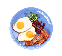 Plate with tasty fried eggs, bacon and beans on white background