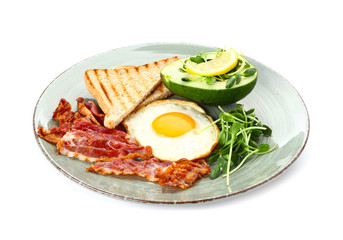 Plate with tasty fried egg, bacon, avocado and toasts on white background