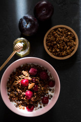 Breakfast with granola, cherry and honey.healthy breakfast Proper nutrition.