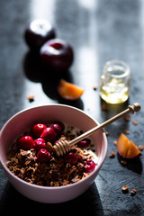 Breakfast with granola, cherry and honey.healthy breakfast Proper nutrition.