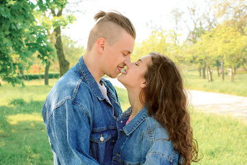 Fototapeta premium Adorable loving couple resting in park
