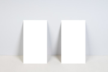 blank business cards on white background with copy space.