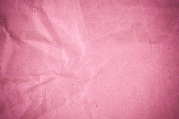 Fototapeta premium Pink crumpled recycle paper background.