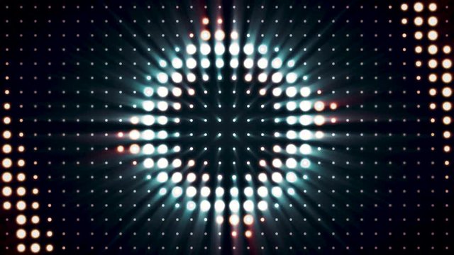 Abstract shining strobe of lights, spotlights background of golden and blue colors, seamless loop. Animation. Glowing soffits on black background, stage lighting concept.
