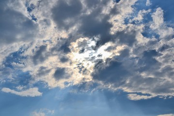 Sunbeam piercing through the clouds. Rays of sunshine breaks through the dark clouds. Faith symbol. Hope, faith, optimism concept