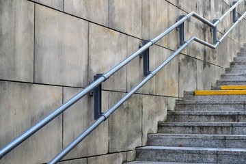 Outdoor stairs with a railing. Stainless steel railing, safety, fall protection. 