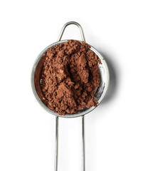 Sieve with cocoa powder on white background