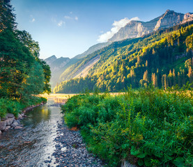 Colorful summer landscape near Obersee lake. Splendid morning view of Swiss Alps, Nafels village...