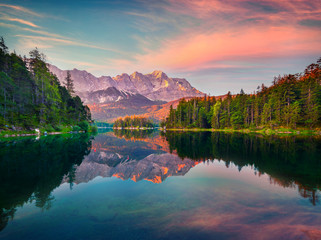 Impressive summer sunrise on the Eibsee lake with Zugspitze mountain range. Splendid outdoor scene...