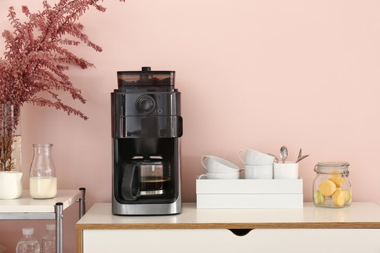 Modern Coffee Machine On Kitchen Table