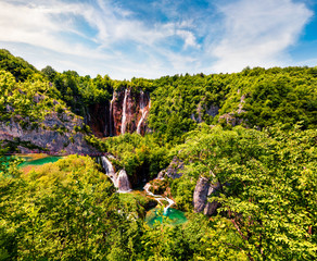 Picturesque morning csene of Plitvice National Park. Colorful spring view of green forest with pure...