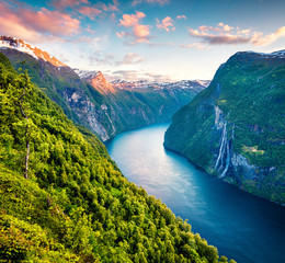 Splendid summer sunset of Sunnylvsfjorden fjord canyon, Geiranger village location, western Norway....