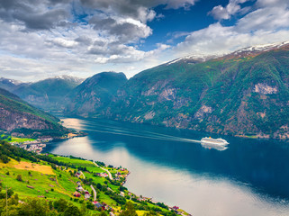 Fototapeta na wymiar Awesome summer view of Sognefjorden fjord. Colorful morning scene with Aurlandsvangen village, Norway. Traveling concept background. Artistic style post processed photo.