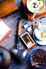 Fresh coffee in cezve on wooden table