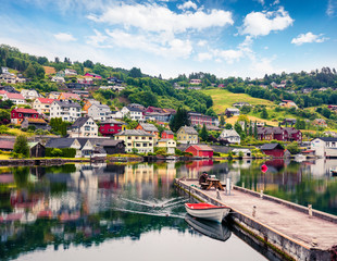 Rainy summer view of Norheimsund village, located on the northern side of the Hardangerfjord. Colorful morning scene in Norway, Europe. Traveling concept background.