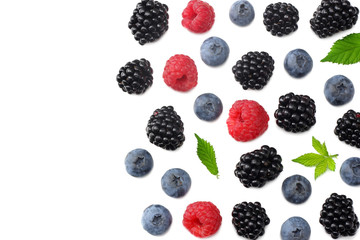mix of blueberries, blackberries, raspberries isolated on white background. top view with copy space