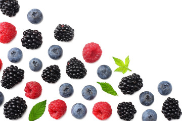 mix of blueberries, blackberries, raspberries isolated on white background. top view with copy space