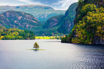 Splendid summer view of Suldalsvatnet lake. Picturesque morning scene in Norway, Europe. Beauty of nature concept background. Artistic style post processed photo.