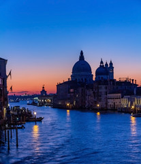 Fototapeta na wymiar Venice is a beautiful and fascinating sunrise on the Grand Canal near the Basilica of Santa Maria della Salute, Venice. Romance, travel concept