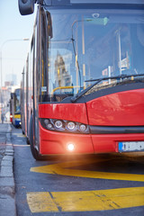 Fototapeta premium Public transportation / bus in urban surroundings on the street.