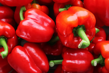 Ripe red peppers as background