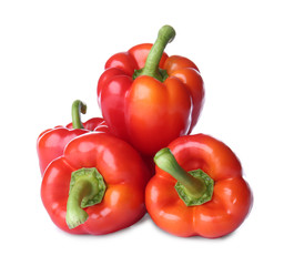 Ripe red peppers on white background