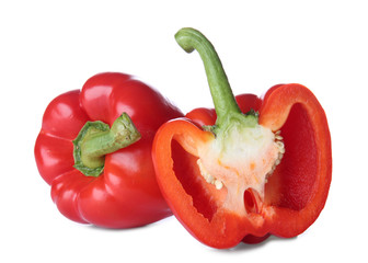 Ripe red peppers on white background