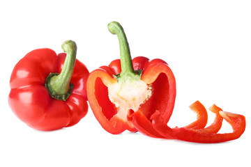 Ripe red peppers on white background