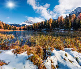 Bright sunny scene of Antorno lake with Tre Cime di Lavaredo (Drei Zinnen) mount. Colorful autumn landscape in Dolomite Alps, Province of Belluno, Italy, Europe. Beauty of nature concept background.