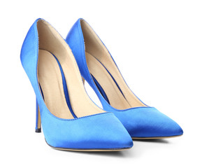 Pair of stylish high-heeled female shoes on white background