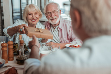 Obraz premium Happy mature loving couple celebrating birthday party