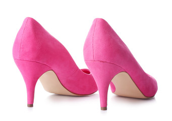 Pair of stylish high-heeled female shoes on white background