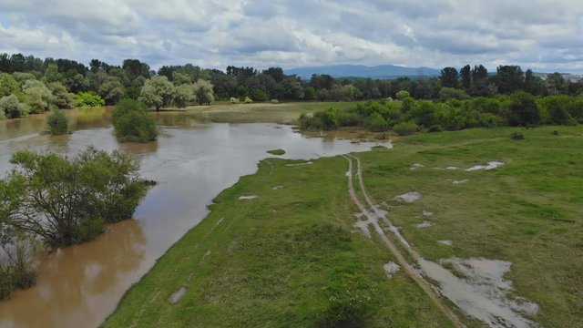 Flooding rivers flooding meadows after heavy rains a cloudy sky UKRAINE